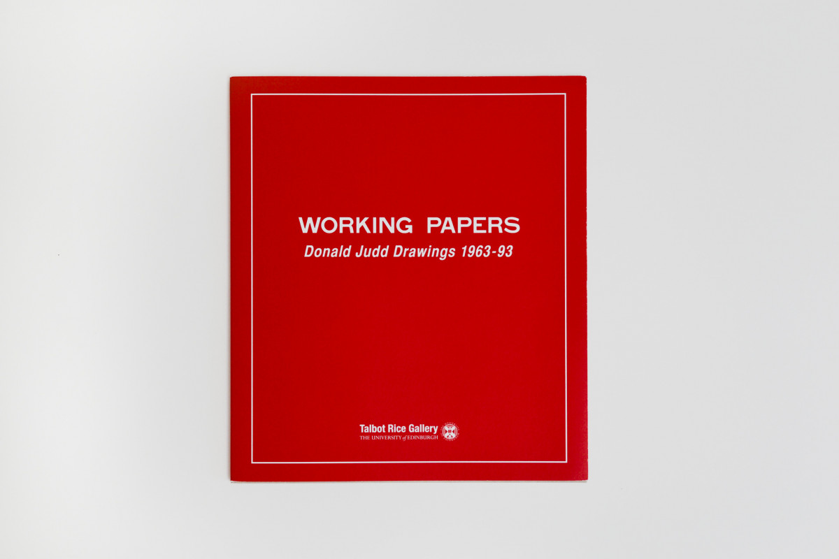 Front page of Donald Judd's book, red background with white text and border