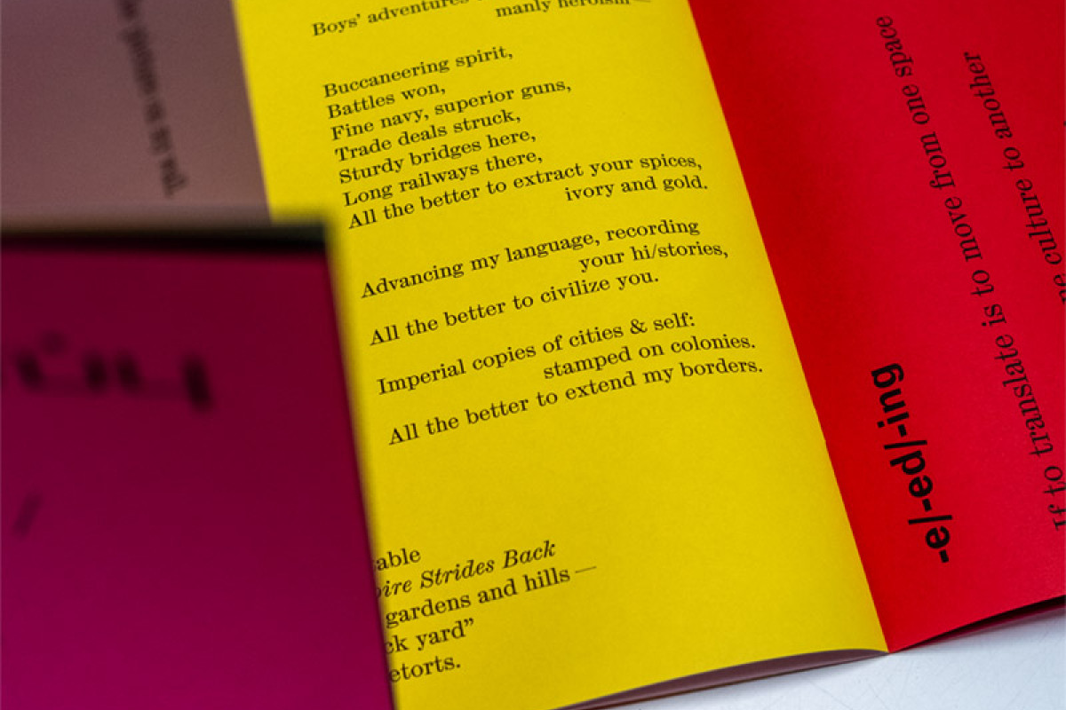 Open page spread of yellow and red pages with black text