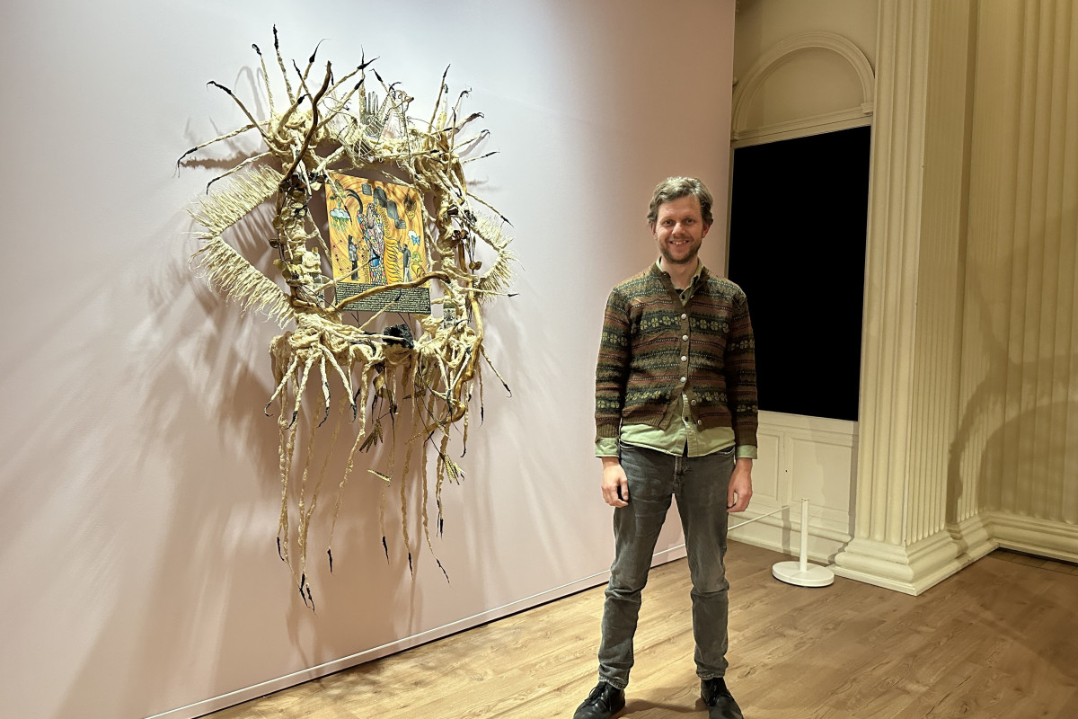 James Clegg, Curator of Guadalupe Maravilla / Piedras de Fuego (Fire Stones) stood infront of an artwork